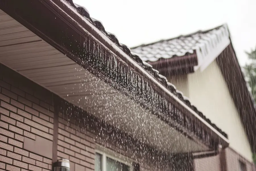 Rain water flowing off of a Texas roof during a hurricane.