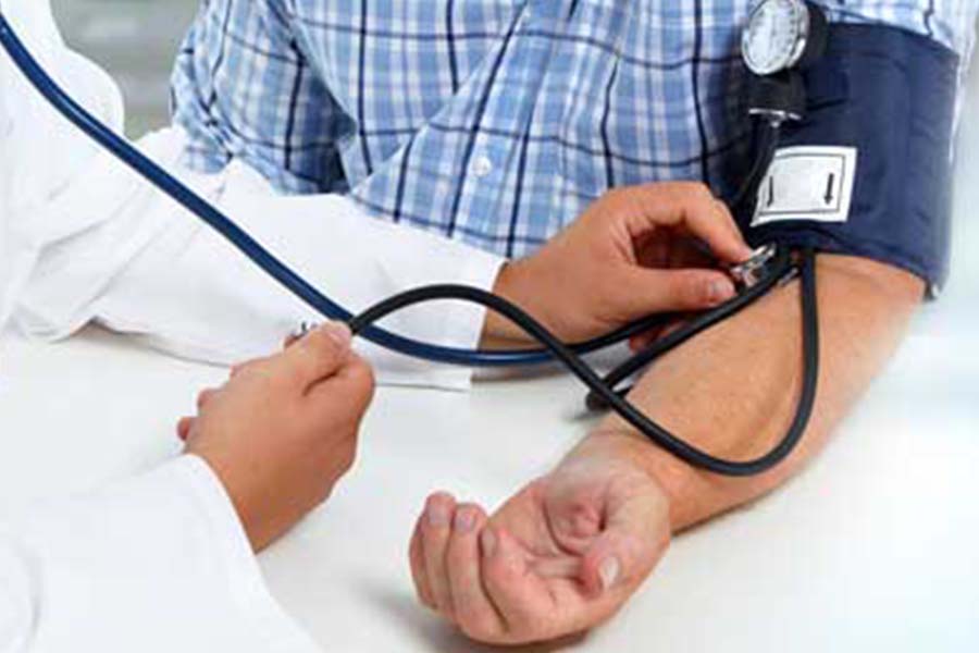 Doctor administrating blood pressure test to patient