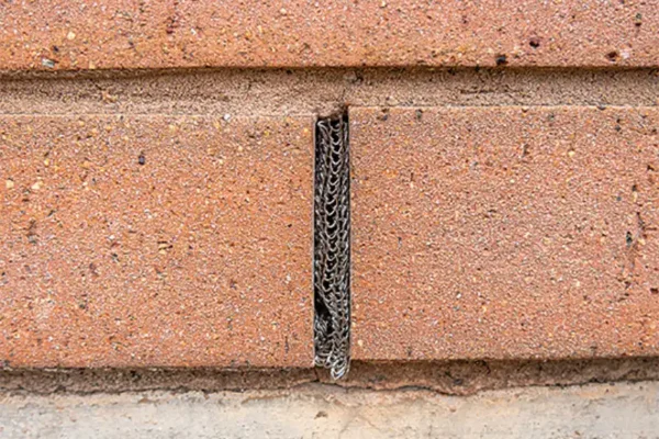 Flexi Armour sealing up a brick weep hole with a steel mesh